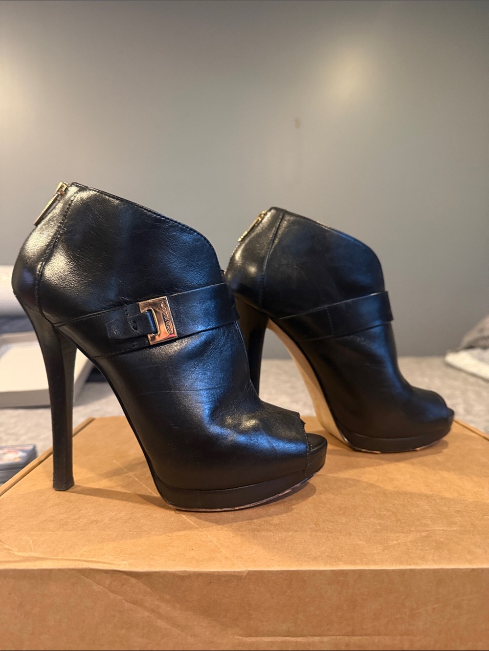 MICHAEL Michael Kors Black Leather Peep-Toe Stiletto Booties with Gold Buckle